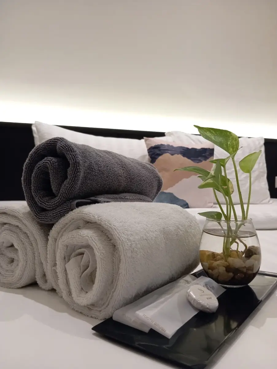 Hotel room amenities including towels and toiletries
